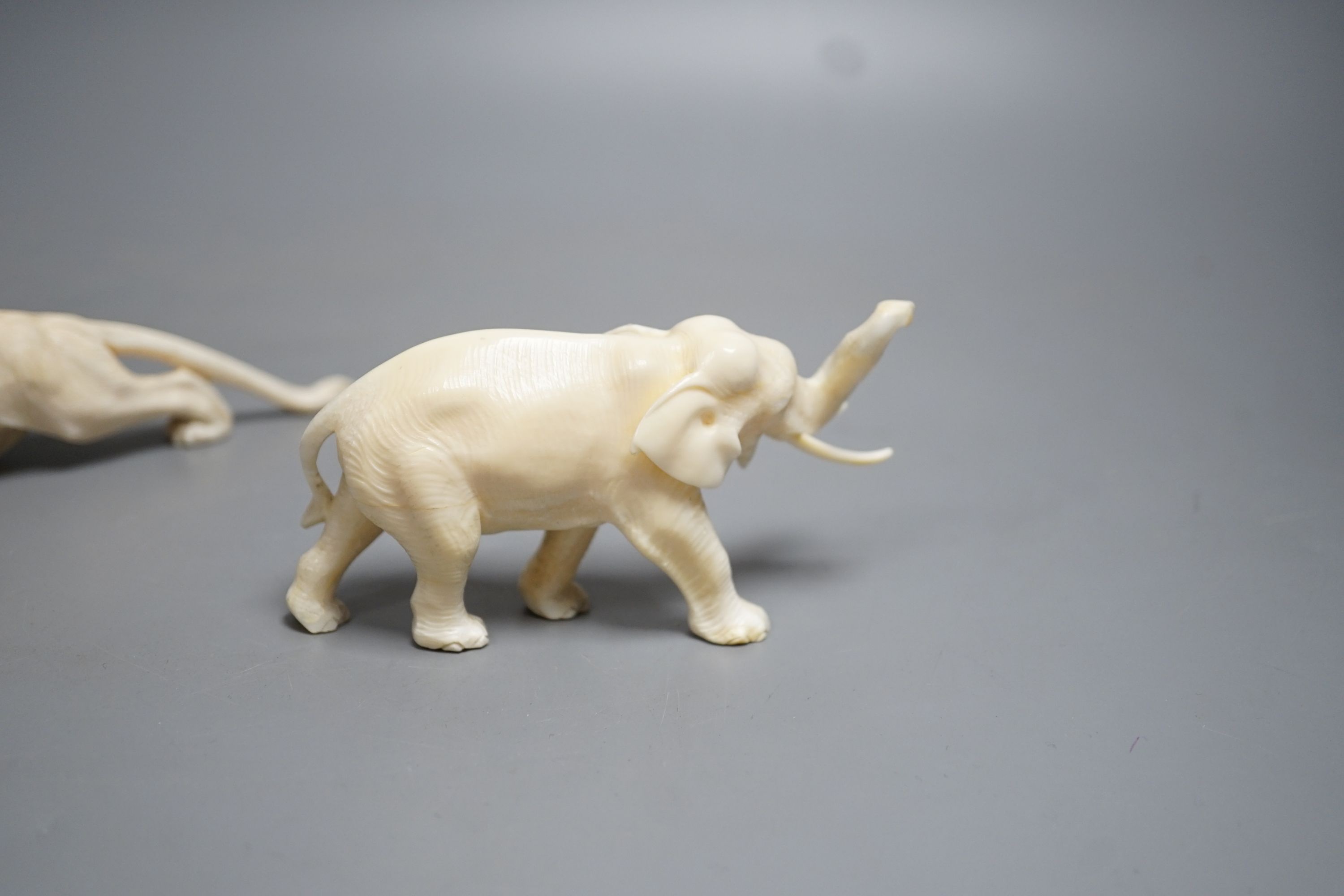 A Japanese Ivory model of an elephant and a similar Ivory model of a lion, early 20th century (2) lion 17cm long